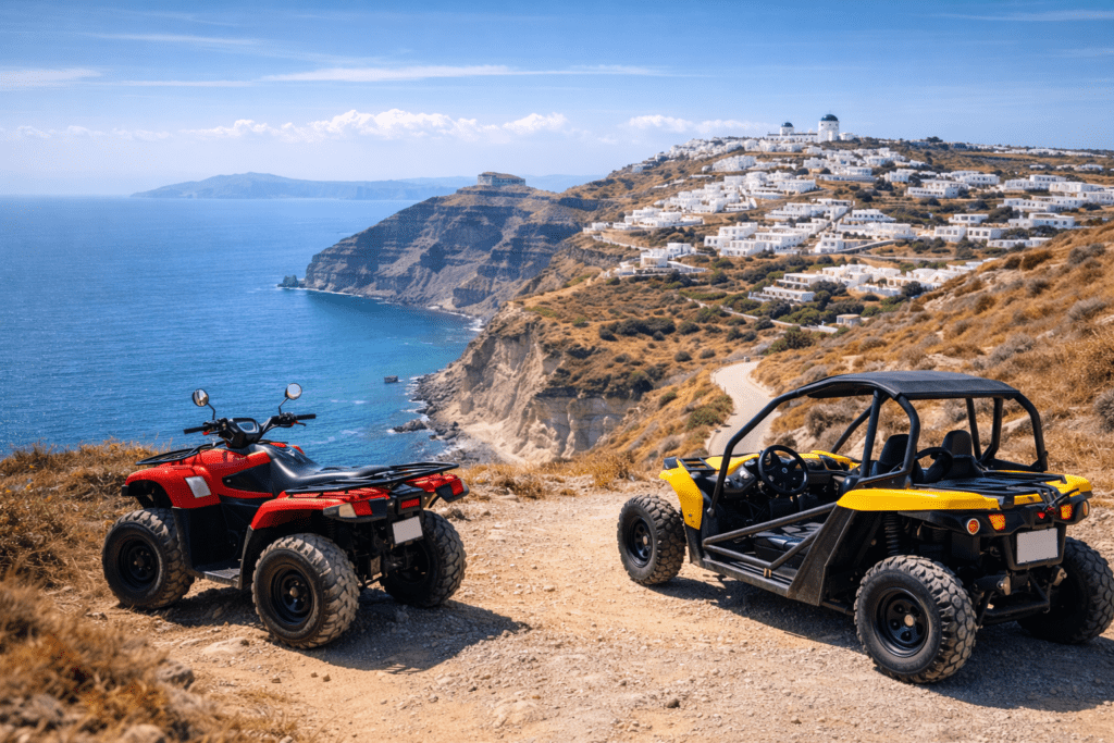 Red ATV and yellow buggy parked on a scenic cliffside road in Santorini with panoramic Aegean Sea views and whitewashed buildings in the background.