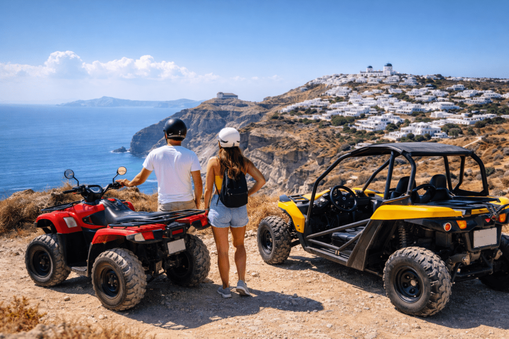 Couple preparing for an ATV and buggy ride in Santorini, overlooking the caldera and white Cycladic buildings on a sunny day.